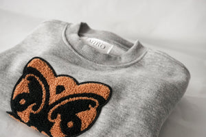 Open image in slideshow, Close-up of Wheku Chenille Appliqué on Grey Crew Neck Sweatshirt
